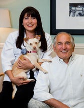Drs. John and Tracy Taddey with Mona Lisa, the dental therapy dog. Image courtesy of Dr. Taddey.