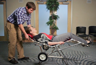 Leah Kenttämaa-Squires and her collaborator Kyle Amick demonstrate the Mantis portable dental chair