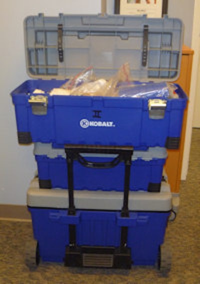 Portable bins of house-call supplies are ready to roll.