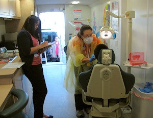Dr. Bergen James spent Monday performing oral screenings at an elementary school in San Francisco's Chinatown as part of the ADA's Give Kids A Smile program.