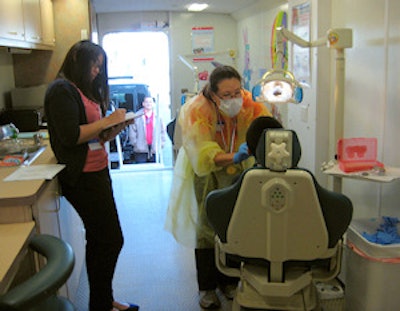 Dr. Bergen James spent Monday performing oral screenings at an elementary school in San Francisco's Chinatown as part of the ADA's Give Kids A Smile program.