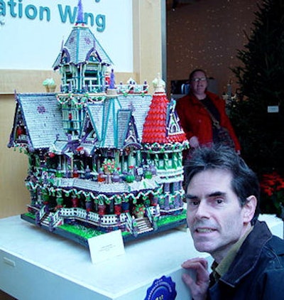 Dr. Learner with his Carson house, which took nine months to complete and took first place at the Cleveland Botanical Garden's 2009 Wintershow contest. The roof lines were all done with fettuccine. He wanted them to be blue, but the yellowish pasta mixed with the blue food coloring came out green, so green they stayed. All images courtesy of Dr. John Learner.