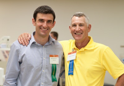 Graduating dentist Michael DeFazio (left) and his uncle, Robert Cuitanov, who received 14 crowns during 18 months of treatment by his nephew.