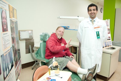 Matthew Polsdorf shows off his new smile, courtesy of student dentist Michael Kezian.