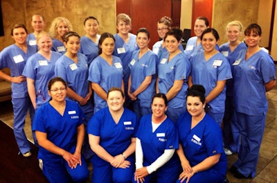 Brewer Dental Education Center's first class of 15 students with four dental assistant instructors.