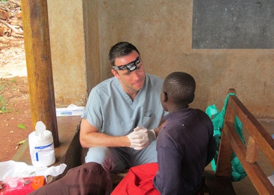 Dr. Shinska treats a young Ugandan boy.