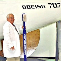 Dr. Trager next to a mockup of a Boeing 707.