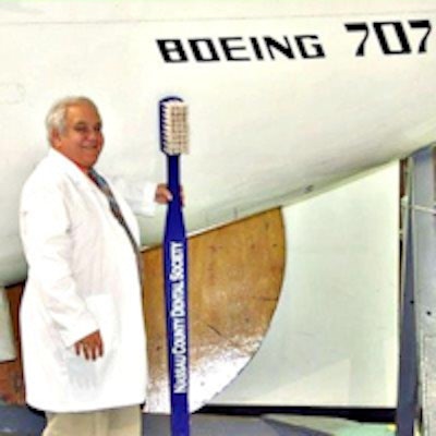 Dr. Trager next to a mockup of a Boeing 707.