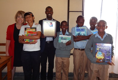 Dr. Harms with students from the St. Peter Igihozo school and Father Remy, who works with Dr. Harms to get the books cleared for the school.