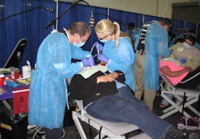 Oral and maxillofacial surgeon Alan Felsenfeld, DDS, works on a patient.