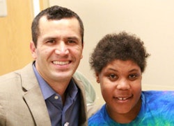 Abrahim Caroci, DMD, a resident at Eastman Institute for Oral Health, with patient Latisha Lucas.