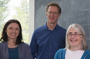 Carla Grandori, MD, PhD (left), and Christopher Kemp, PhD, with researcher Kay Gurley perfected a technique to sift through thousands of genes in cancer cells to find potential drug targets.
