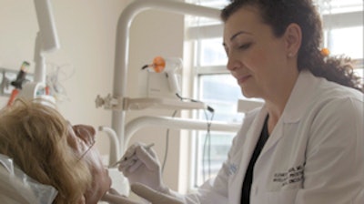 Elizabeth Feldman, DMD, a maxillofacial prosthodontist and dental oncologist at the University of Florida Cancer Center Orlando, with patient Ingrid Hellender, who was diagnosed with sinus cancer. Image courtesy of the University of Florida Cancer Center Orlando.