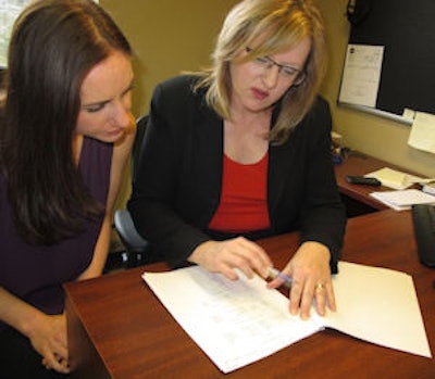 Leah Smith (left) and Linda Lévesque, PhD, discuss the research findings. Image courtesy of Queen's University.