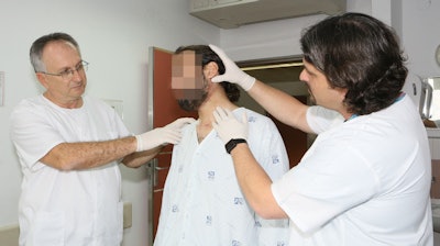 Adi Rachmiel, DMD, PhD (left), and Yoav Leiser, DMD, PhD, with the Syrian patient. All images courtesy of Rambam Health Care Campus.