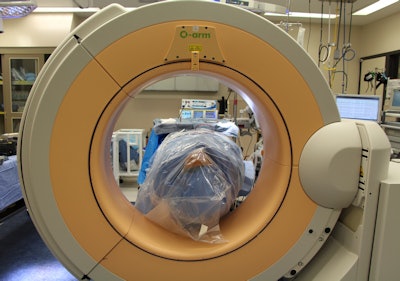 An intraoperative portable CT scan is being performed after open reduction of a facial fracture. Upon satisfactory reduction, confirmed by the scan, incisions are closed and no further imaging is necessary. If the scan shows a need for modification of the reduction or facial implant, adjustments are made at that time. No postoperative imaging is required. All images courtesy of Dr. David Shaye.