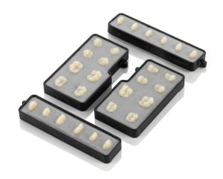 Pala Mix & Match denture teeth in a special blank form secured in a retaining apparatus. The tooth blocks would then be milled based on a virtual denture model. Image courtesy of Heraeus Kulzer.