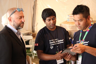 Left to right: Avishai Sadan, DMD, dean of the USC Herman Ostrow School of Dentistry; Santosh Sundaresan, BDS, DDS; and volunteer Brian Truong. Image courtesy of John Hobbs.