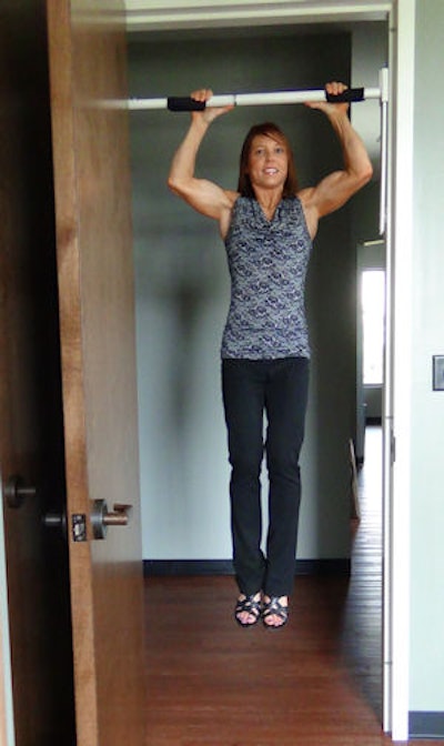 Dr. Walker hangs from a chin-up bar in her practice. She recommends every dental office should have one over a doorway, because it is an inexpensive way to align the back.