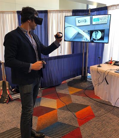 Dr. Justin Barad demonstrates the Osso VR virtual surgery simulator. Image courtesy of Osso VR.