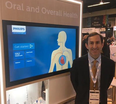 Peter Bright of Philips showcases the company's new informational kiosks at CDA Presents 2018 in Anaheim.