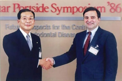 Sunstar Group Chairman Hiroo Kaneda (left) shakes hands with Dr. Robert Genco, PhD, (right) in 1986. Image courtesy of UB.