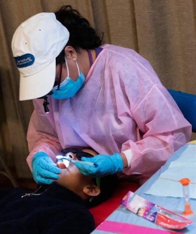Students receive oral care via a school-based dental program. Image courtesy of NYU Photo Bureau.