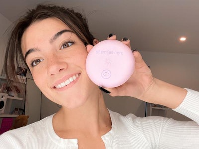 Social media influencer Charli D'Amelio and her namesake Invisalign aligner case. Image courtesy of Align Technology.