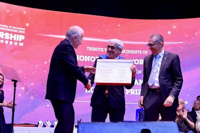 Stanley M. Bergman receiving the honorary doctorate degree from HU. Image courtesy of Henry Schein.
