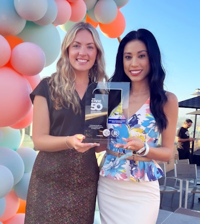 PDS team members Carli Kingsley, senior manager of corporate social responsibility, left, and Rosalinda Olague, director of school relations and dental assistant programs, pictured with the 2022 The Civic 50 award. Image courtesy of PDS.