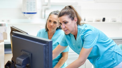 Female Dentists Computer