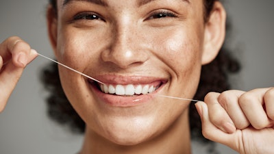 Flossing Woman