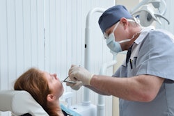 Woman Tooth Extraction Dentist