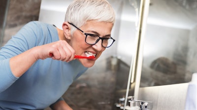 Woman Brushing Teeth