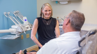 Dr. Taylor talks with one of her patients. Images courtesy of Dr. Cathy Taylor.