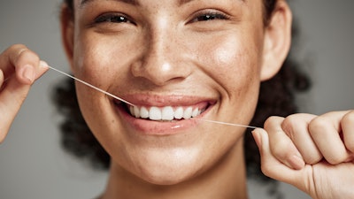 Flossing Woman