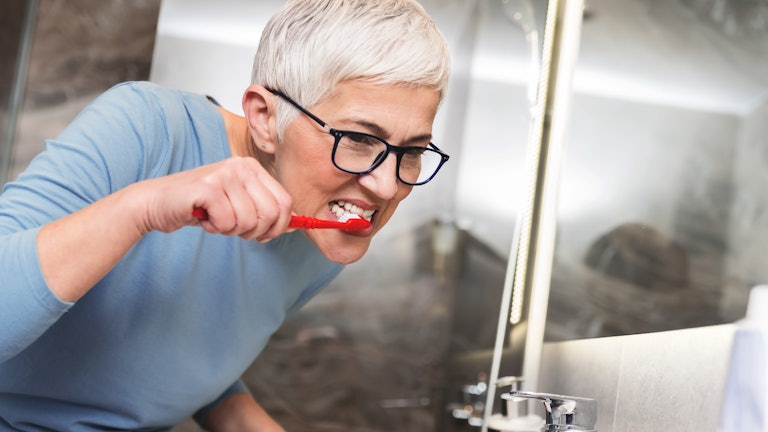 Woman Brushing Teeth