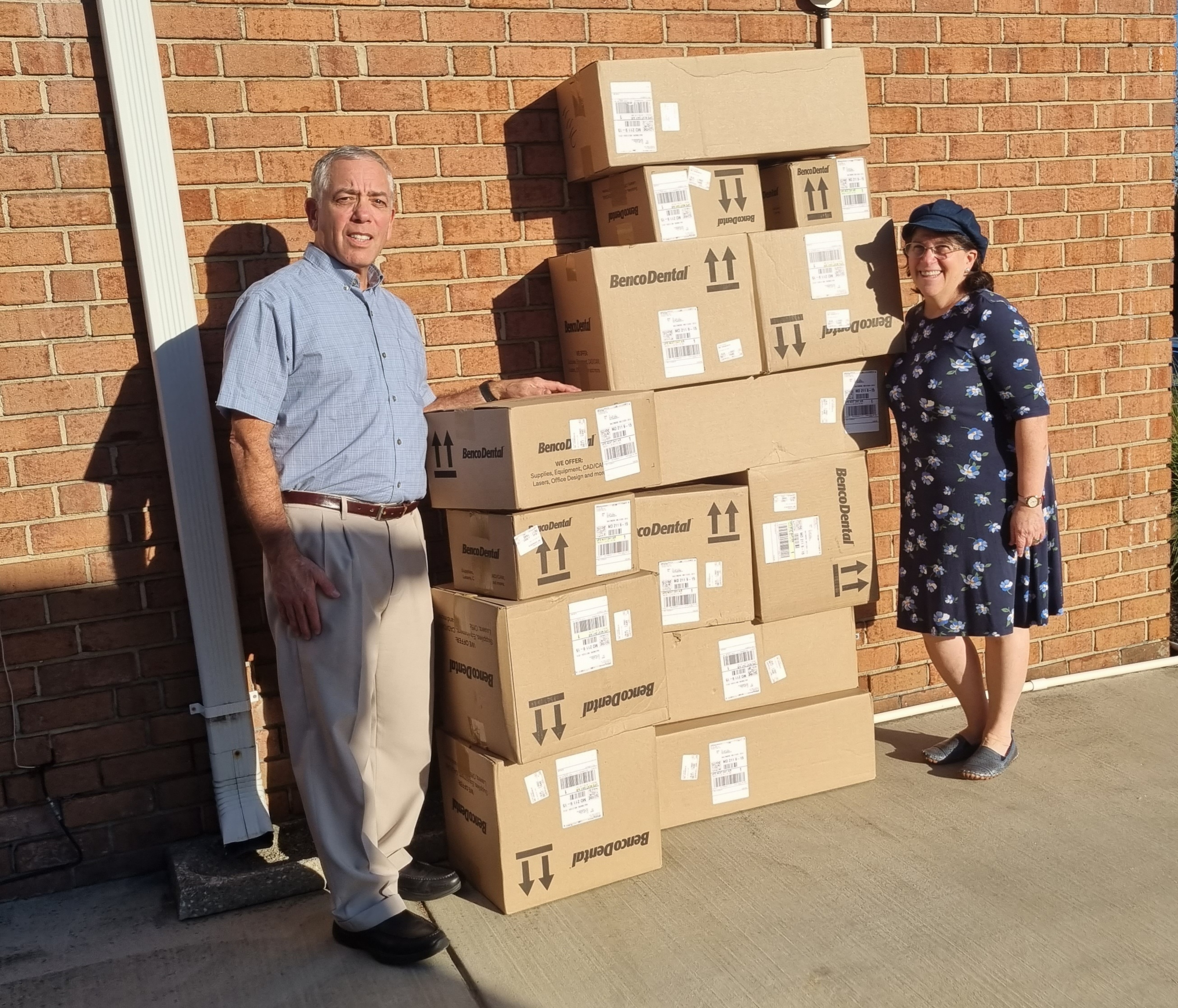 Dr. Gary Bauman and his wife, Sherri, pose with Benco Dental oral care products they delivered to soldiers in Israel. Image courtesy of the Baumans.
