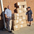 Dr. Gary Bauman and his wife, Sherri, pose with Benco Dental oral care products they delivered to soldiers in Israel. Image courtesy of the Baumans.