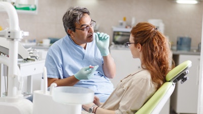 Dentist Advise Patient