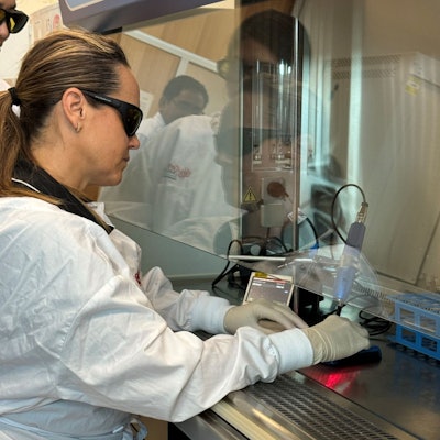 Doctoral candidate Simone Sleep tests the Nuralyte device on cells. Image courtesy of Griffith University.