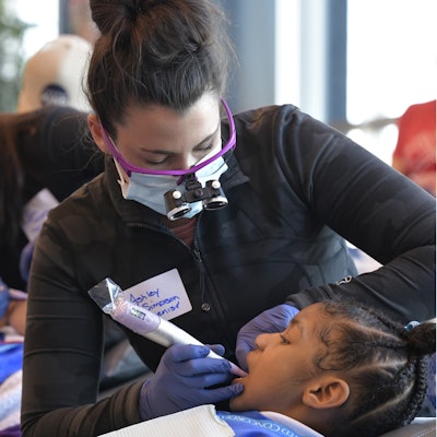 As long-term partners, Dentsply Sirona and TeamSmile hosted several events over the last few years. On Giving Tuesday in 2022, approximately 200 children from schools in Charlotte, NC, received free dental services at the Bank of America Stadium. Image and caption courtesy of Dentsply Sirona.