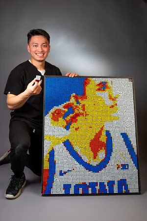 Brian Dang pictured next to his Rubik's Cube creation. Image courtesy of Brian Dang.