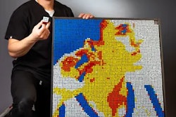 Brian Dang pictured next to his Rubik's Cube creation. Image courtesy of Brian Dang.