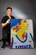 Brian Dang pictured next to his Rubik's Cube creation. Image courtesy of Brian Dang.
