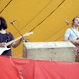 Jerry Garcia and Bob Weir of the Grateful Dead play their first show at Folsom Field, University of Colorado Boulder, on September 3, 1972. Photograph by Dan Fong. Image and caption courtesy of CU Anschutz School of Dental Medicine.