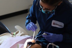 Dental therapist Sarah Chagnon treats a patient at the Swinomish Dental Clinic in La Conner, WA, as part of a school-based 'sealant week' program. More states are considering authorizing licensures of dental health aide therapists, also known as dental therapists. Experts say the midlevel practitioners can help fill gaps in access to dental health care. Image courtesy of Swinomish Dental Clinic.