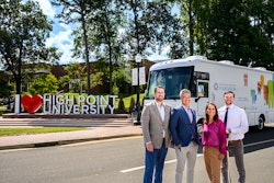 The PDS Foundation donated its mobile dental clinic to the High Point University Workman School of Dental Medicine on July 23, 2024. Pictured (left to right): Dr. Kevin Cain, senior associate dean for administration and finance, the Workman School of Dental Medicine; Michael Le, executive director, the PDS Foundation; Dr. Johanna Tesoniero, associate dean for clinical operations, the Workman School of Dental Medicine; Jeffrey Lewallen, manager of strategic initiatives, the Workman School of Dental Medicine. Image and caption courtesy of the PDS Foundation.