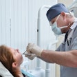 Woman Tooth Extraction Dentist