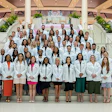 High Point University’s Workman School of Dental Medicine held its first white coat ceremony for its inaugural class of 60 students inside the Nido and Mariana Qubein Arena and Conference Center. Image and caption courtesy of High Point University.